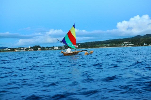 A guy in an outrigger sped by