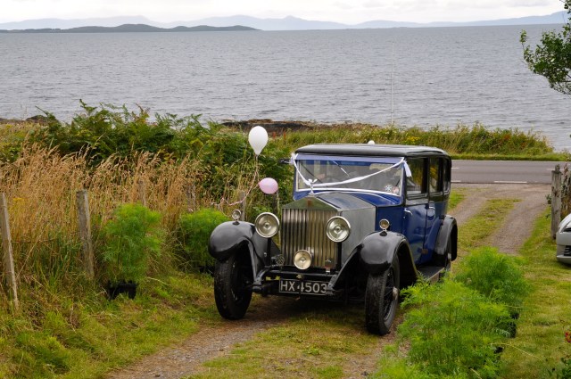 The bride arrives. Vintages Rolls are the normal form of transport. The glass screen between the back seats and the driver stops the sheep licking your neck