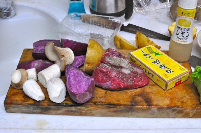 I wrap up potatoes and Beni Imo in foil packages that also contain butter salt and pepper. I slice  tough lump of beef and put green stuff on it.  