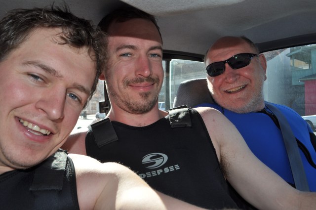 There are two bucket seats, which means James is sitting on the center console. Notice pained expression.