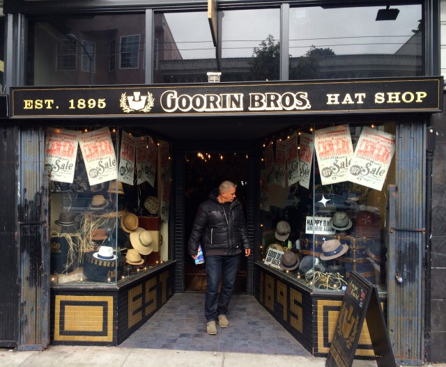 Man with no hair looks for hat