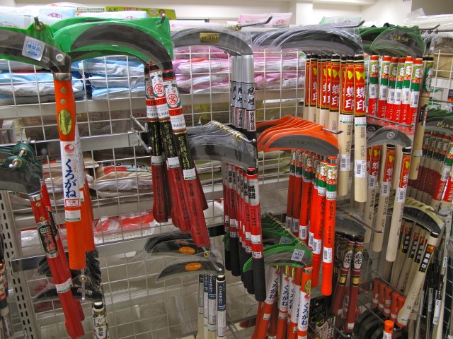 The Okinawans do not have scythes but cut hay and undergrowth with tiny hand sickles.