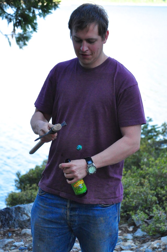 Ben opens beer with an axe.