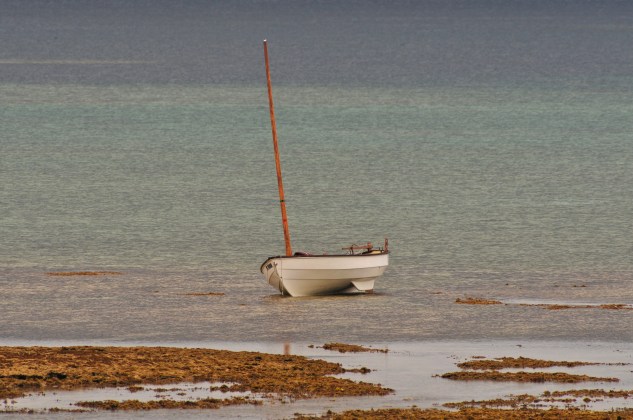 So, so shallow, I have to anchor the boat way out in the lagoon and even there she dries out.