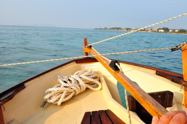 Check out the cleat that I have screwed onto the tiller. It was a drag having both hands full.