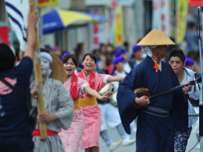 The street is crammed with dancers. It is 32 degrees with high humidity.