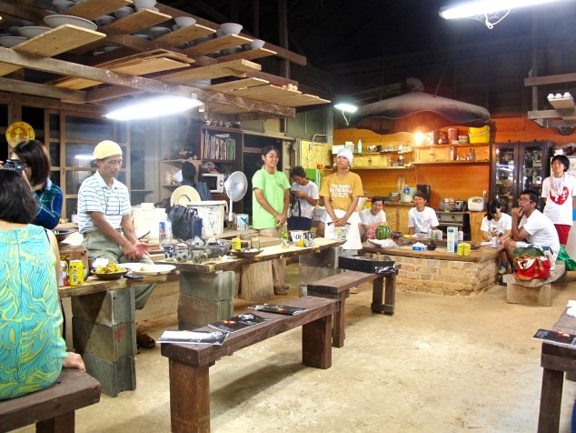 What a great place for a party. Notice earth floor and drying pottery.